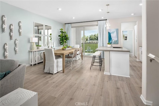 16359 Meadowhouse Ave, Chino, CA 91708 - dining room with light wood finished floors, recessed lighting, and baseboards
