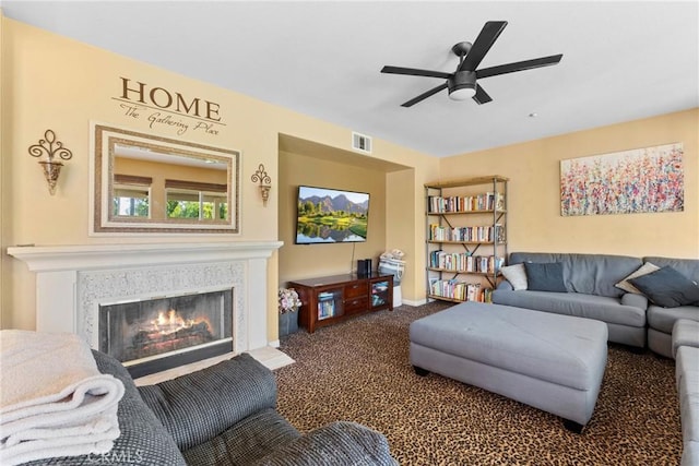 1137 Pamplona Dr, Riverside, CA 92508 - carpeted living room with ceiling fan, a fireplace with flush hearth, and baseboards
