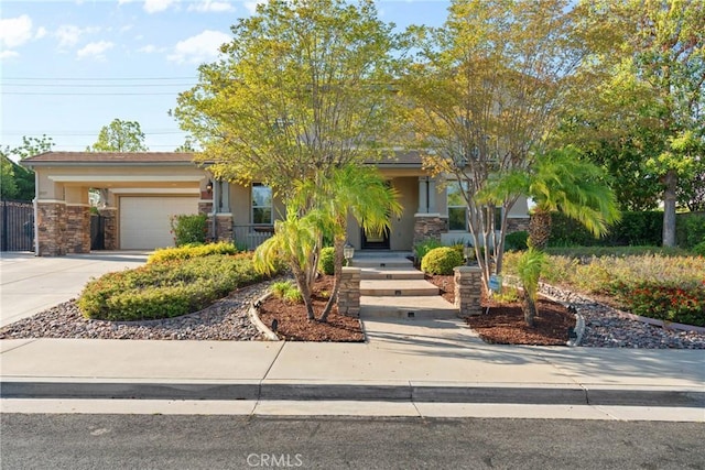 1137 Pamplona Dr, Riverside, CA 92508 - obstructed view of property featuring stone siding, concrete driveway, a garage, and stucco siding