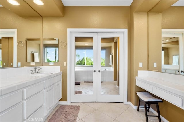 1137 Pamplona Dr, Riverside, CA 92508 - bathroom with french doors, vanity, tile patterned flooring, and baseboards