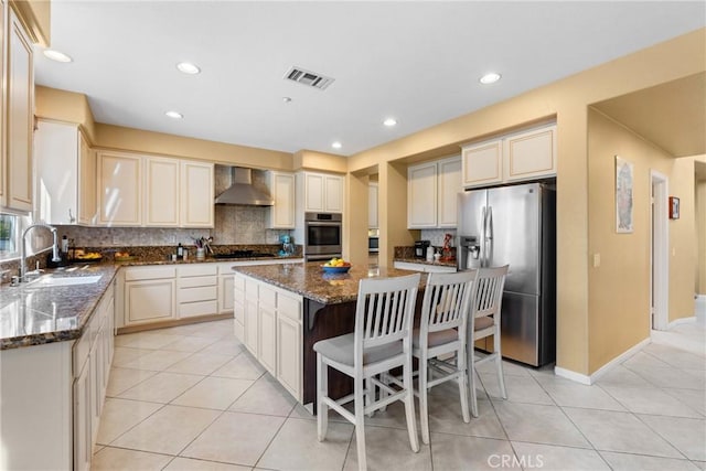 1137 Pamplona Dr, Riverside, CA 92508 - kitchen with a sink, stainless steel appliances, wall chimney range hood, a center island, and light tile patterned floors