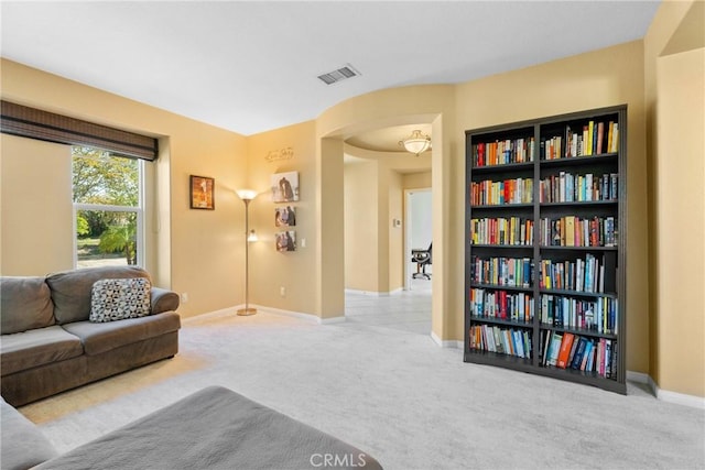 1137 Pamplona Dr, Riverside, CA 92508 - living room with carpet, arched walkways, and baseboards