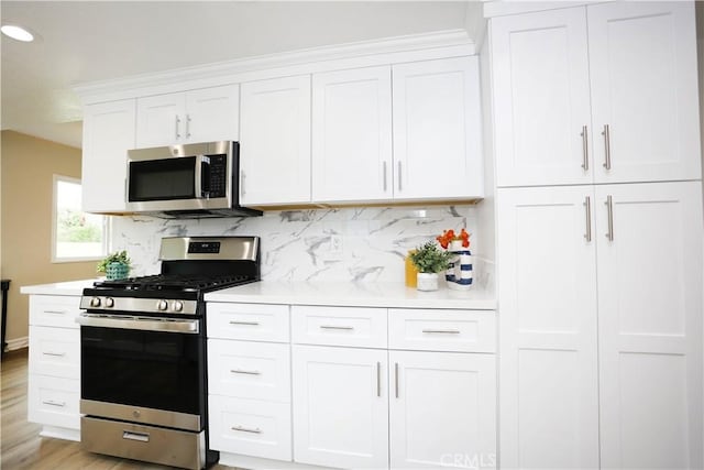 321 S Beachy Pl, Anaheim, CA 92804 - kitchen featuring stainless steel appliances, white cabinets, and light countertops