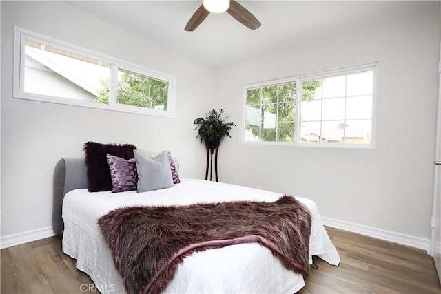 321 S Beachy Pl, Anaheim, CA 92804 - bedroom featuring multiple windows, baseboards, wood finished floors, and ceiling fan