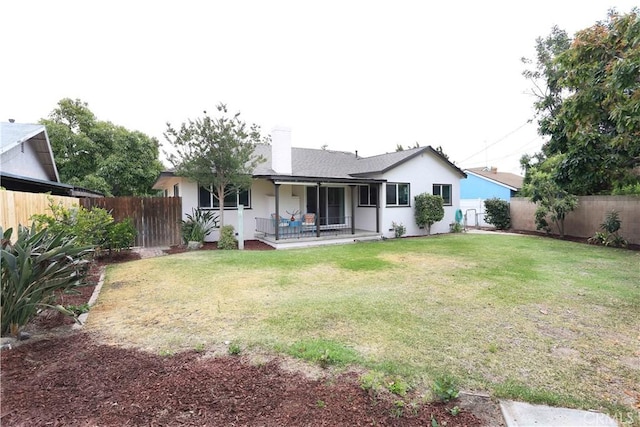 321 S Beachy Pl, Anaheim, CA 92804 - rear view of house featuring stucco siding and a chimney