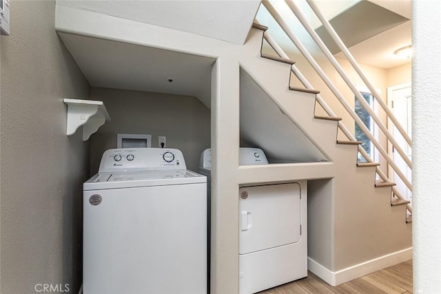 33772 Copper Lantern St Unit B, Dana Point, CA 92629 - laundry room featuring washer and clothes dryer, wood finished floors, and baseboards