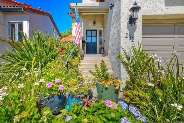 232 Hygeia Ct, Encinitas, CA 92024 - property entrance featuring stucco siding, a garage, and a tiled roof
