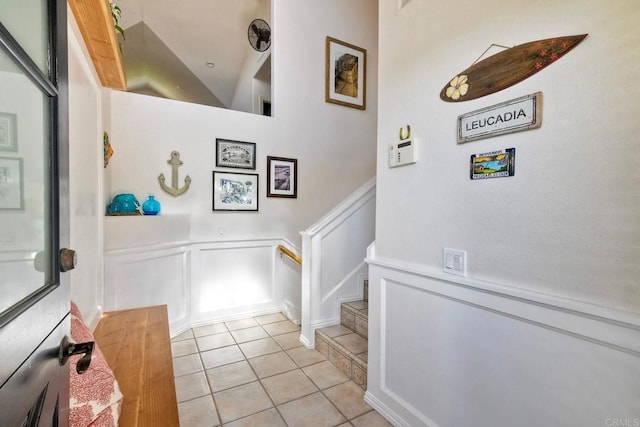 232 Hygeia Ct, Encinitas, CA 92024 - stairway with a decorative wall, tile patterned floors, and a wainscoted wall