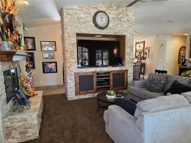 42036 Desert Sage Ave, Lancaster, CA 93536 - carpeted living area featuring a stone fireplace, lofted ceiling, and a ceiling fan