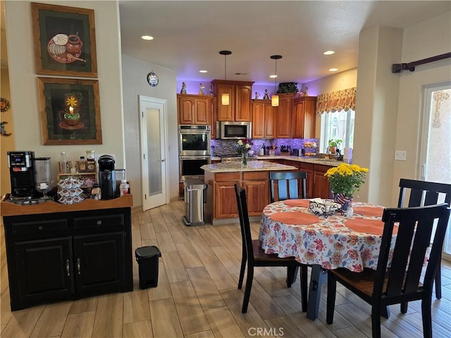 42036 Desert Sage Ave, Lancaster, CA 93536 - dining room with light wood-style floors and recessed lighting