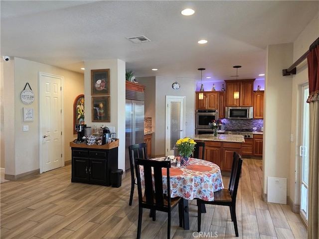 42036 Desert Sage Ave, Lancaster, CA 93536 - dining space featuring light wood-type flooring, recessed lighting, and baseboards
