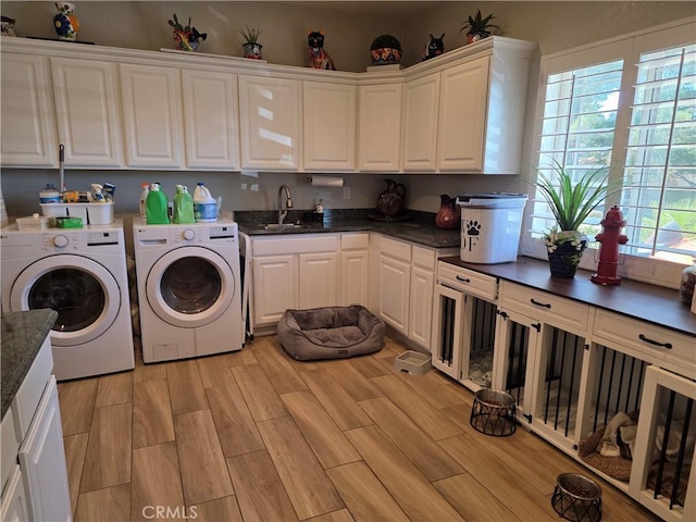 42036 Desert Sage Ave, Lancaster, CA 93536 - laundry area featuring cabinet space, washing machine and clothes dryer, and light wood-type flooring