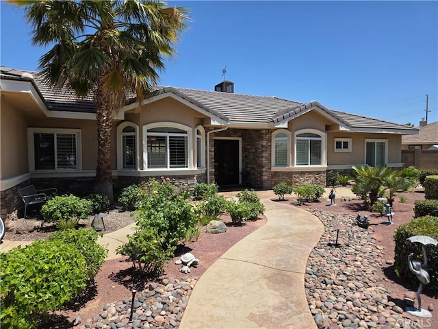 42036 Desert Sage Ave, Lancaster, CA 93536 - single story home with a tiled roof, stucco siding, stone siding, and a chimney