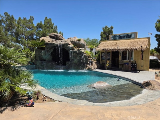42036 Desert Sage Ave, Lancaster, CA 93536 - outdoor pool featuring a storage structure, an outdoor structure, and a patio area