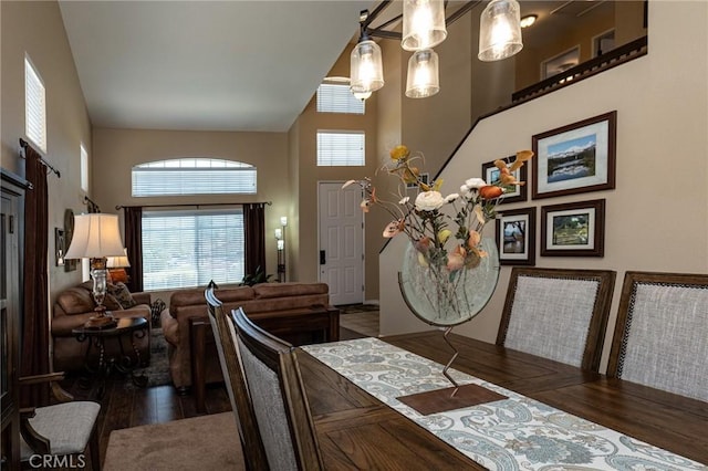 8340 Rosemary Dr, Riverside, CA 92508 - dining room featuring wood finished floors and a towering ceiling