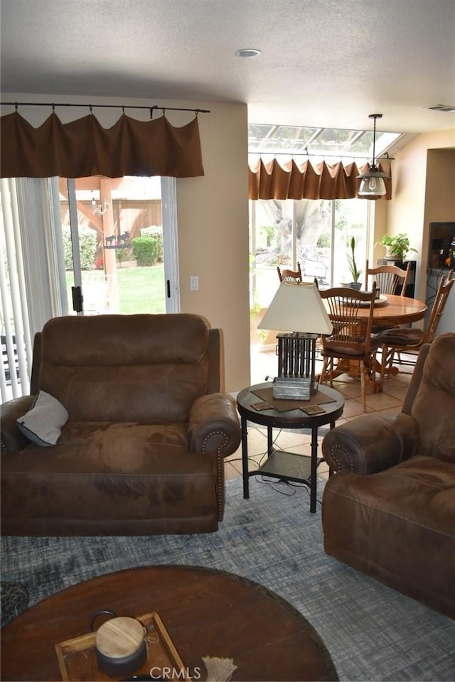 8340 Rosemary Dr, Riverside, CA 92508 - carpeted living room featuring a textured ceiling