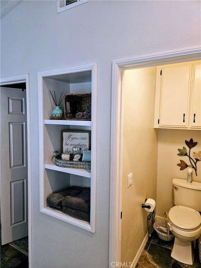 8340 Rosemary Dr, Riverside, CA 92508 - bathroom featuring baseboards and toilet