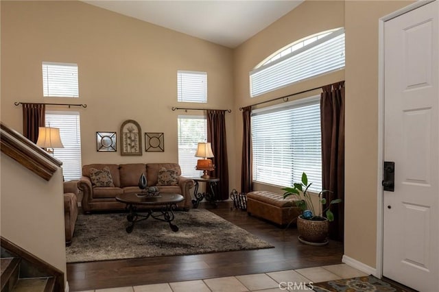 8340 Rosemary Dr, Riverside, CA 92508 - living room featuring high vaulted ceiling, wood finished floors, and baseboards