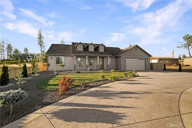 5539 Erin Way, Paradise, CA 95969 - new england style home with board and batten siding, an attached garage, and concrete driveway