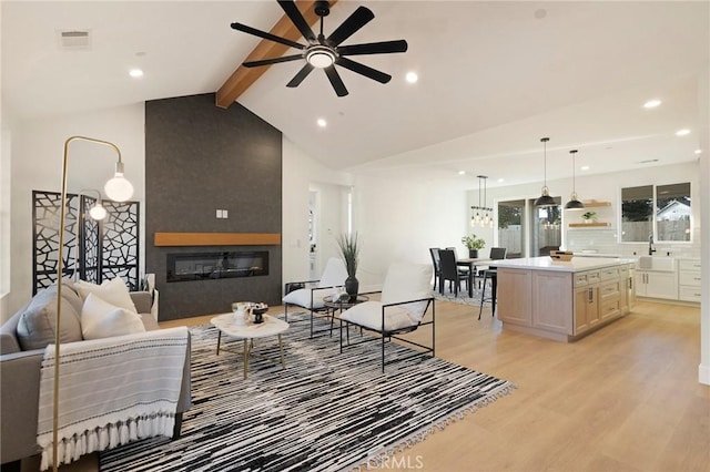 5539 Erin Way, Paradise, CA 95969 - living area featuring ceiling fan, light wood-style floors, a fireplace, and recessed lighting