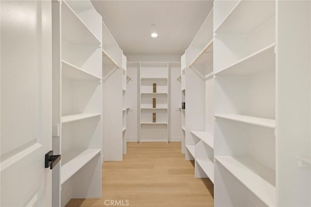 5539 Erin Way, Paradise, CA 95969 - spacious closet featuring wood finished floors
