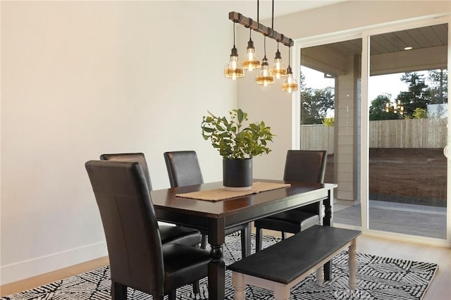 5539 Erin Way, Paradise, CA 95969 - dining area with wood finished floors, baseboards, and a chandelier