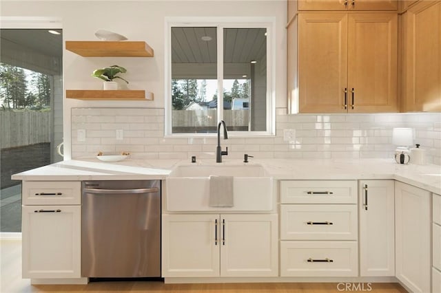 5539 Erin Way, Paradise, CA 95969 - kitchen featuring stainless steel dishwasher, a sink, open shelves, and light stone counters