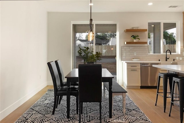 5539 Erin Way, Paradise, CA 95969 - dining area with plenty of natural light, light wood finished floors, baseboards, and recessed lighting