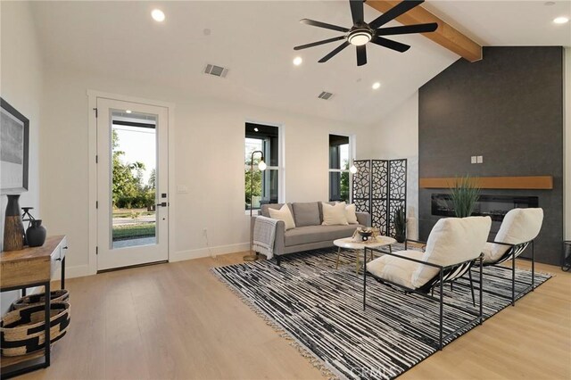 5539 Erin Way, Paradise, CA 95969 - living room with a glass covered fireplace, light wood-type flooring, recessed lighting, ceiling fan, and baseboards