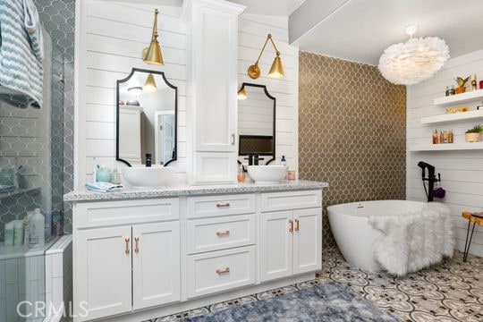 41350 Calle Bandido, Murrieta, CA 92562 - bathroom with double vanity, a freestanding bath, and a stall shower