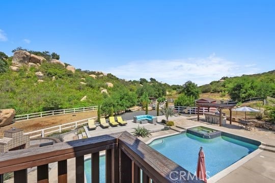 41350 Calle Bandido, Murrieta, CA 92562 - view of pool with a pool with connected hot tub and a patio area