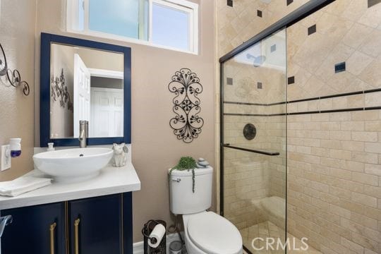 41350 Calle Bandido, Murrieta, CA 92562 - bathroom featuring vanity, a tile shower, and toilet
