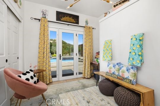 41350 Calle Bandido, Murrieta, CA 92562 - doorway with french doors and wood finished floors