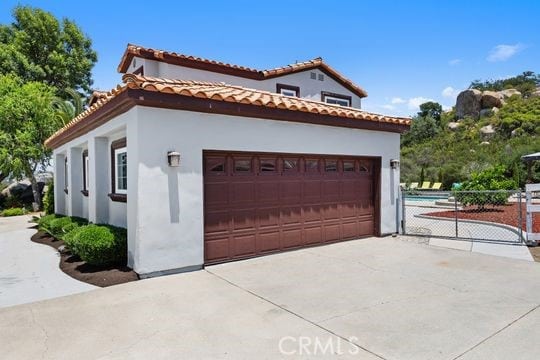 41350 Calle Bandido, Murrieta, CA 92562 - view of front of property featuring a garage and stucco siding