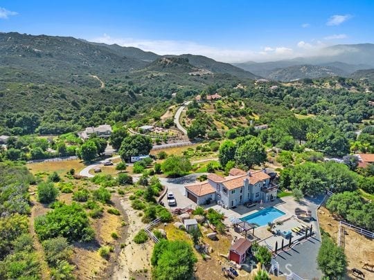 41350 Calle Bandido, Murrieta, CA 92562 - drone / aerial view of a pool area and a mountain backdrop