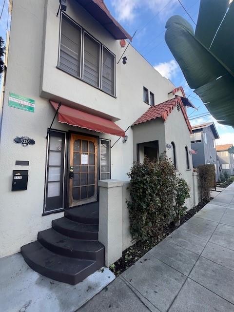 3320 E 8th St, Long Beach, CA 90804 - view of front facade featuring stucco siding