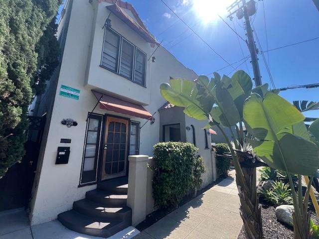 3320 E 8th St, Long Beach, CA 90804 - view of side of property with stucco siding