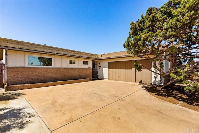 1597 Hermes St, San Diego, CA 92154 - ranch-style home featuring a garage, brick siding, and concrete driveway