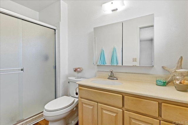 1597 Hermes St, San Diego, CA 92154 - full bathroom with vanity, a shower stall, and toilet