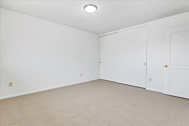 1597 Hermes St, San Diego, CA 92154 - unfurnished bedroom featuring carpet, a textured ceiling, a closet, and baseboards