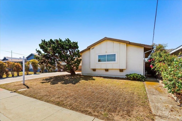 1597 Hermes St, San Diego, CA 92154 - view of front of home with board and batten siding and a front lawn