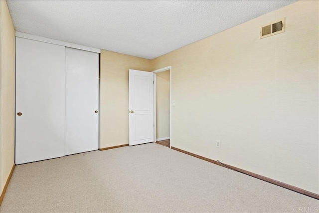 1597 Hermes St, San Diego, CA 92154 - unfurnished bedroom with carpet flooring, a closet, baseboards, and a textured ceiling