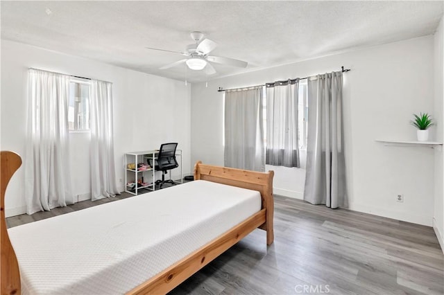 40632 Lela May Ave, Hemet, CA 92544 - bedroom with wood finished floors, ceiling fan, and baseboards