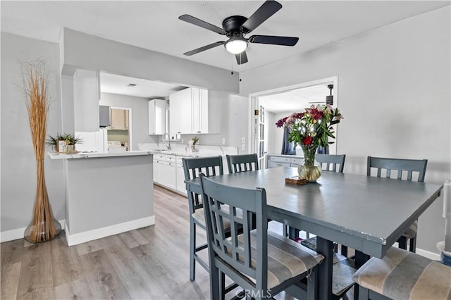 40632 Lela May Ave, Hemet, CA 92544 - dining room with ceiling fan, light wood finished floors, and baseboards