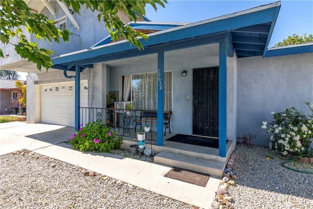 40632 Lela May Ave, Hemet, CA 92544 - entrance to property featuring covered porch, concrete driveway, stucco siding, and an attached garage