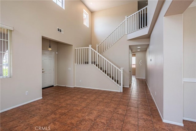 35602 Driftwood St, Winchester, CA 92596 - foyer featuring a towering ceiling, stairs, and baseboards