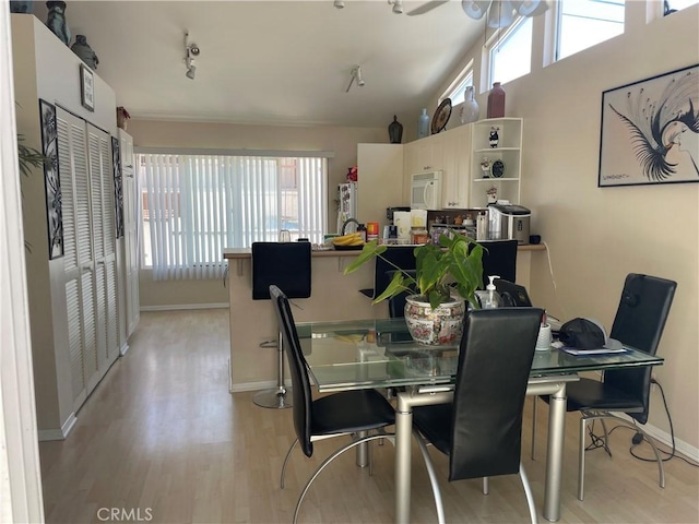 927 W 6th St, San Pedro, CA 90731 - dining space with plenty of natural light, light wood finished floors, and lofted ceiling