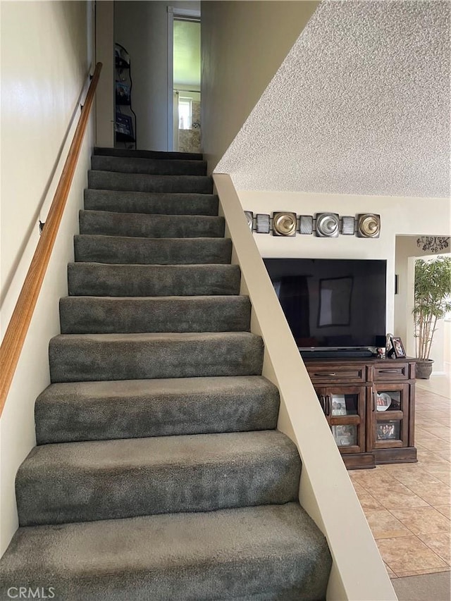 927 W 6th St, San Pedro, CA 90731 - staircase with tile patterned floors and a textured ceiling