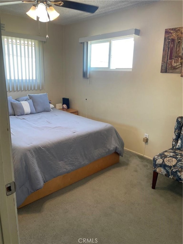 927 W 6th St, San Pedro, CA 90731 - carpeted bedroom with multiple windows and a ceiling fan