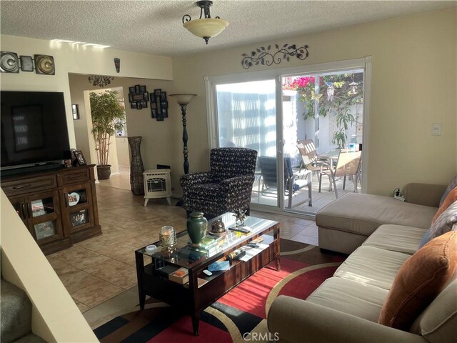 927 W 6th St, San Pedro, CA 90731 - living area with tile patterned flooring and a textured ceiling